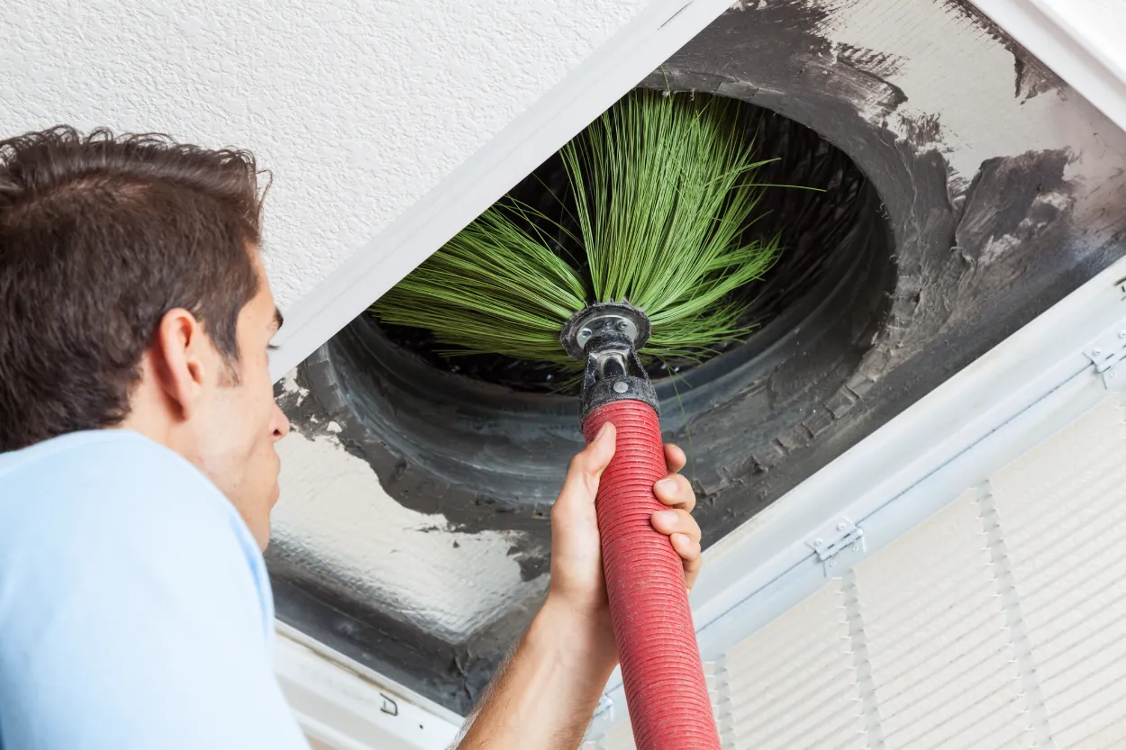 hvac tech cleaning duct